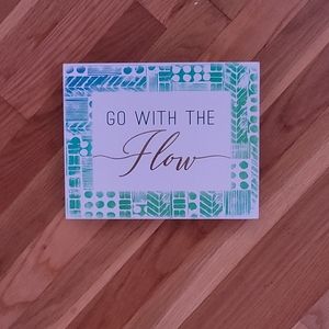 Blue/Green sign gold lettering , go with the flow